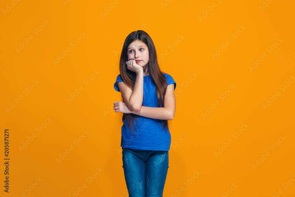 Young serious thoughtful teen girl. Doubt concept. Young serious thoughtful teen girl. Doubt concept.
