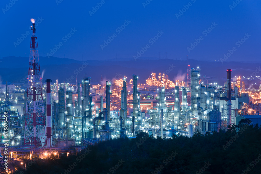 Aerial view Oil refinery.Industrial view at oil refinery plant form industry zone with sunrise and cloudy sky. and Petrochemical background sunset.