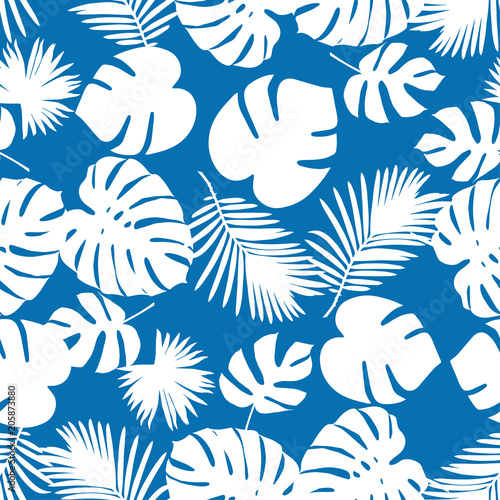 Seamless vector background with decorative leaves. Texture of palm leaves. Textile rapport.