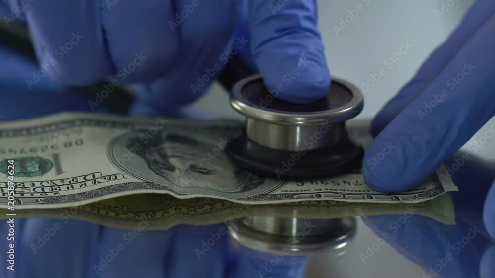 Diagnostics of dollar with stethoscope, financial market monitoring concept
