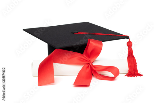 Graduation cap and certificate with red tassel isolated on white background