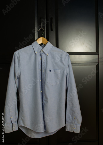 Unkept shirt hanging on closet