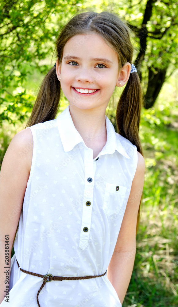 Portrait of adorable smiling little girl outdoors Portrait of adorable smiling little girl outdoors
