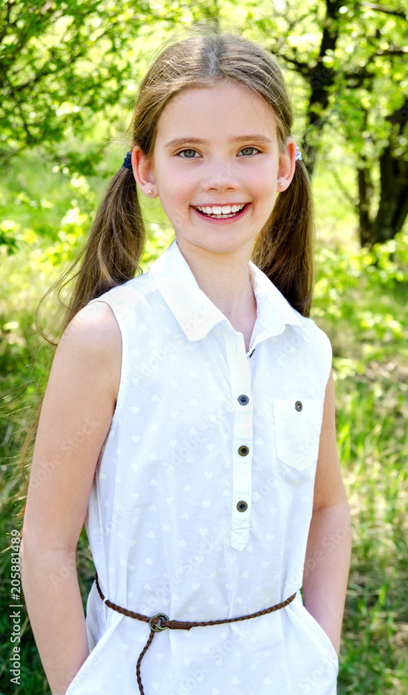 Portrait of adorable smiling little girl outdoors Portrait of adorable smiling little girl outdoors