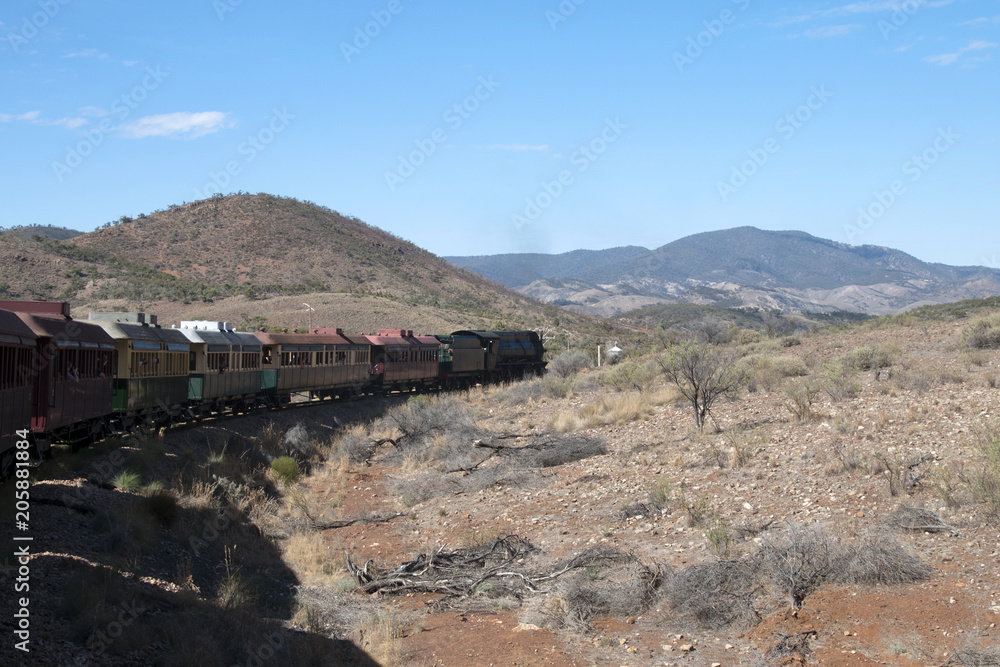 Quorn South Australia, vintage steam train travelling through semi arid landscape