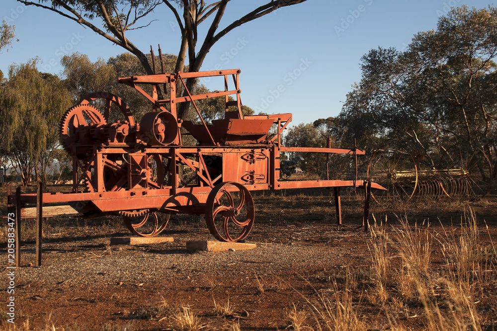 Fototapeta premium Quorn South Australia, obsolete farming equipment left to rust in the afternoon sunlight