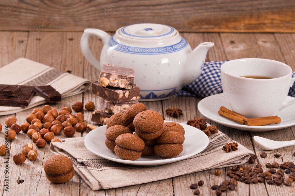 Hazelnut shortbread sandwiches filled with chocolate cream. Hazelnut shortbread sandwiches filled with chocolate cream.