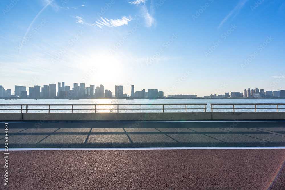 empty road with panoramic city skyline