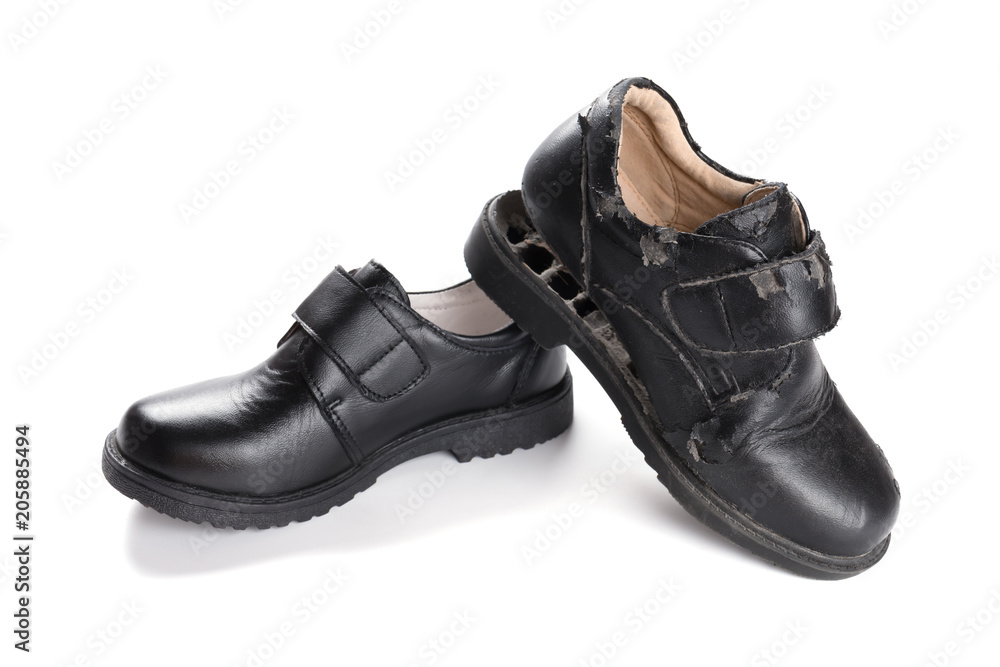 a new leather shoe and a damaged old one on white a new leather shoe and a damaged old one on white