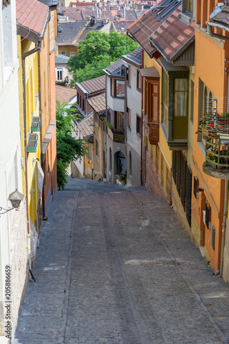 Old medieval narrow stone paved street in Buda district of Budapest on a sunny day in summer. Shot at Gul Baba street.