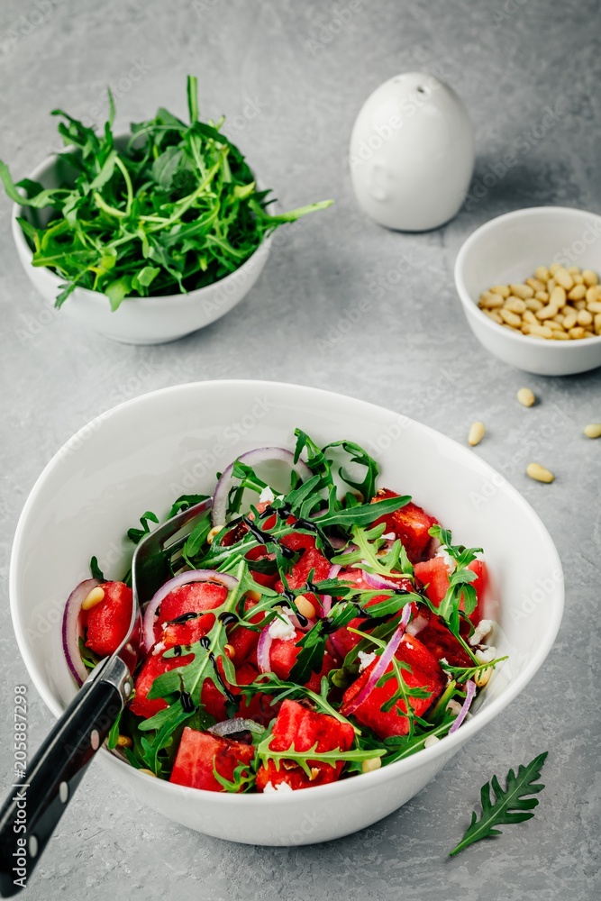 Watermelon with feta, arugula, onion, pine nuts and balsamic sauce. Watermelon with feta, arugula, onion, pine nuts and balsamic sauce.