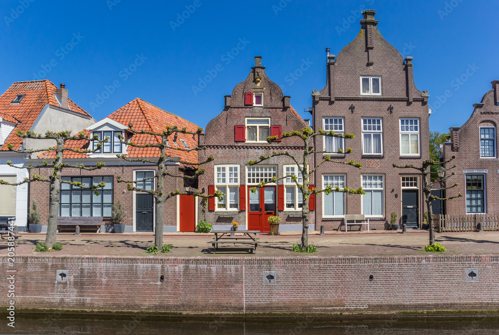 Historic houses at a canal in Hasselt, The Netherlands