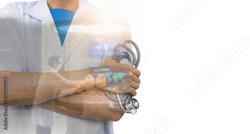 Double exposure of Doctors holding stethoscope on hospital background.