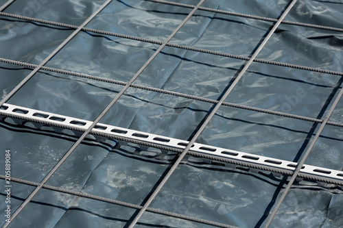 Quadro em tela Close up of concrete reinforcement steel mesh with linear metal rebar spacer on