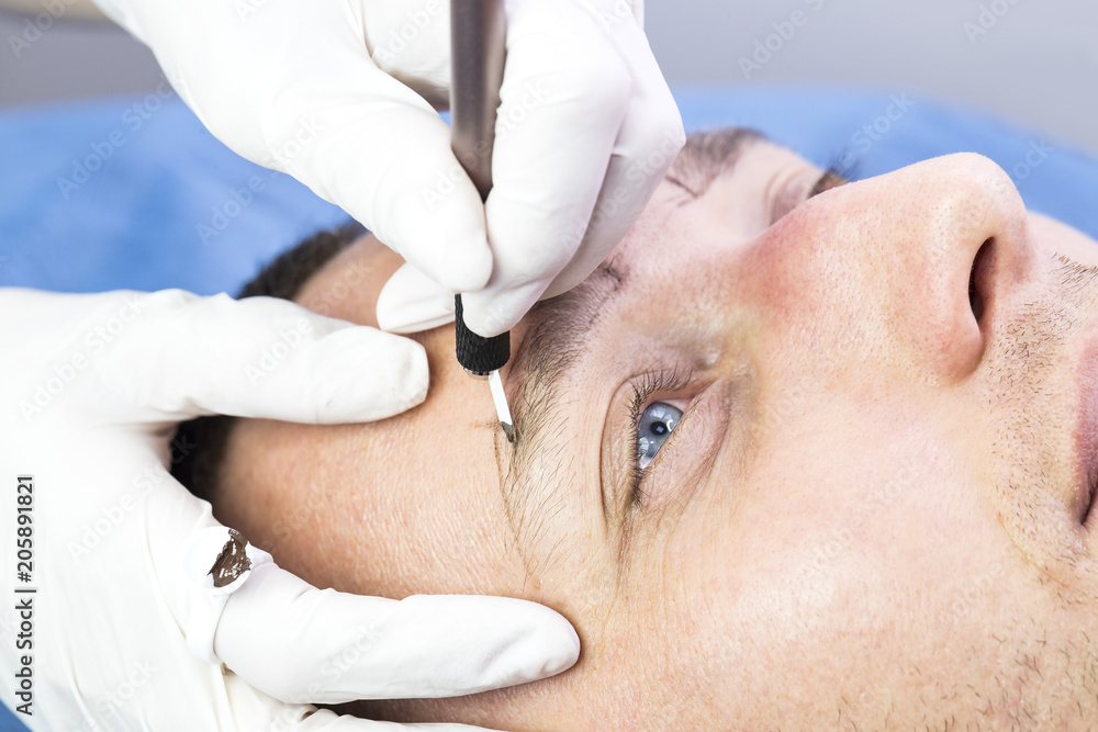 Naklejka premium Microblading eyebrows workflow in a beauty salon 