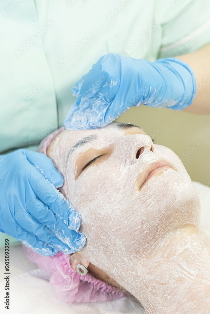 Massage and facial peels at the salon using cosmetics Massage and facial peels at the salon using cosmetics