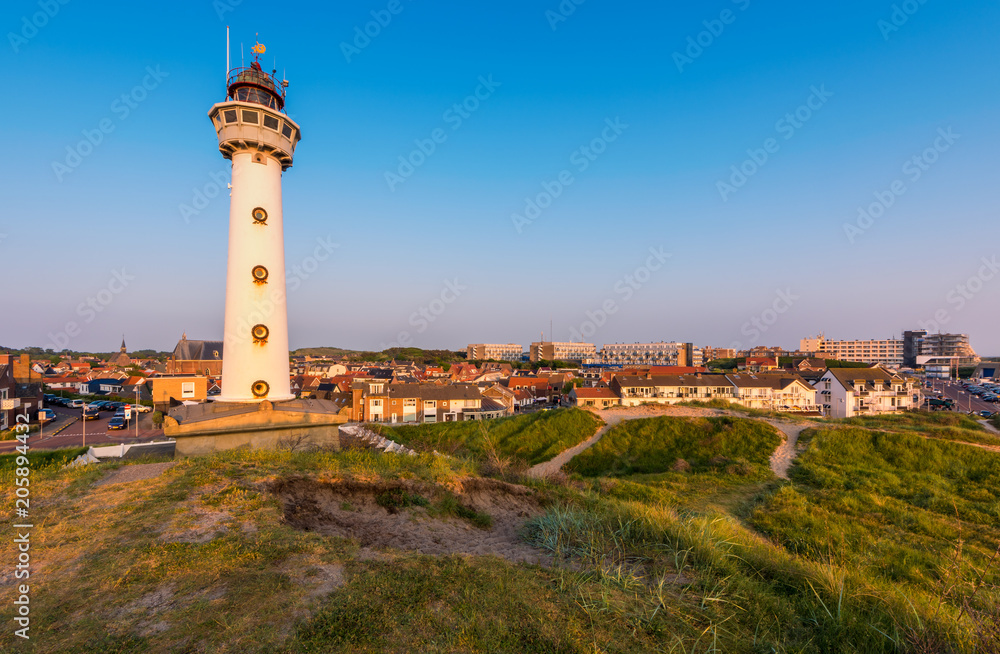 Lighthouse and skyline of Egmond aan Zee, a coastal village in North Holland, The Netherlands