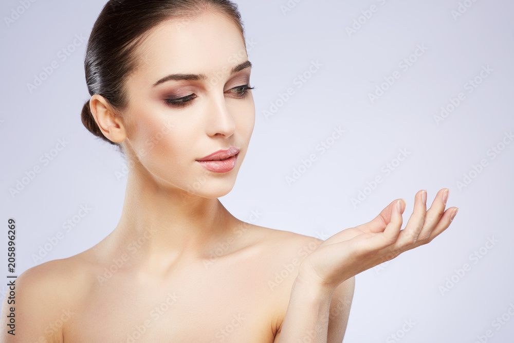 Attractive girl at grey studio background Attractive girl at grey studio background