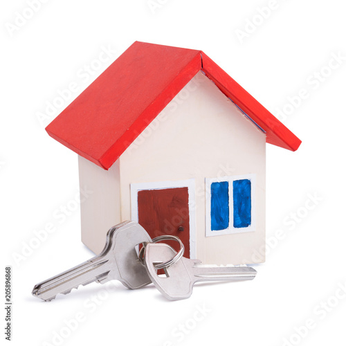 Buying or selling concept of one house with red roof and a key isolated on white background