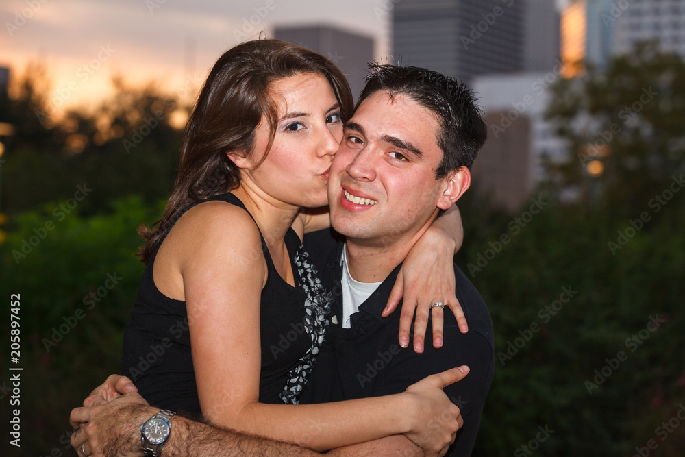 Fototapeta premium Young couple outdoor portrait in a downtown urban park