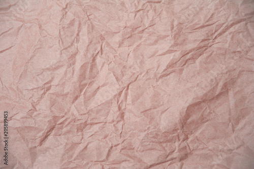 Light pink crumpled paper texture for background