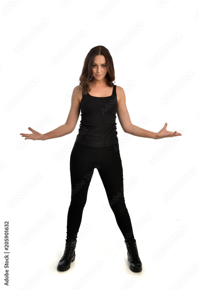 Free Photo  Young female in black singlet, pants holding mobile