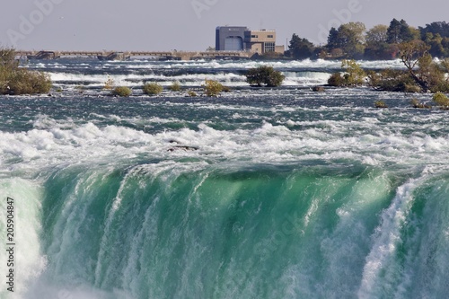 Photo of a powerful Niagara waterfall in autumn