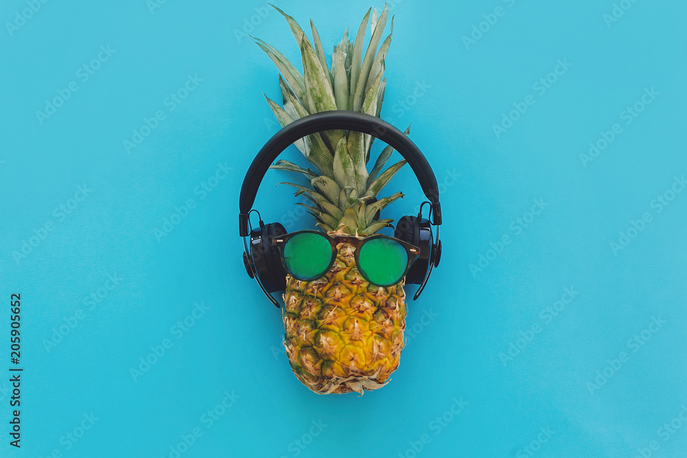 pineapple in stylish hipster sunglasses and black headphones on blue trendy  paper background, flat lay. modern summer vacation concept. fruit flat lay,  pool party and music theme Stock Photo | Adobe Stock