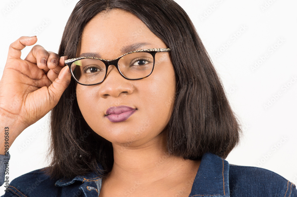 close up of woman adjusting her glasses isolated on white background