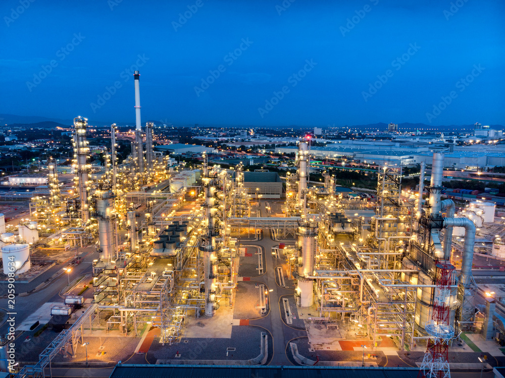 Fototapeta premium Aerial view of chemical oil refinery plant, power plant at sunset sky for industry concept.