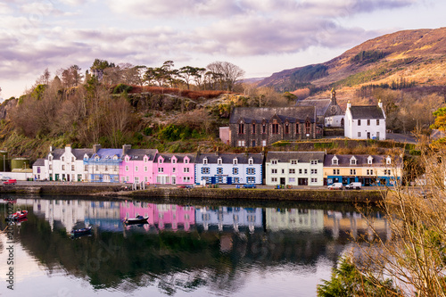Reflections of Coloured houses in harbour, Portree, Scotland