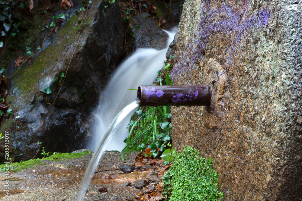 Natural water coming out of a fountain Natural water coming out of a fountain