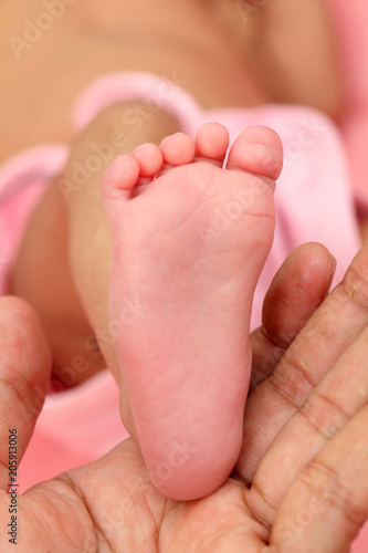 Tiny foot of newborn baby