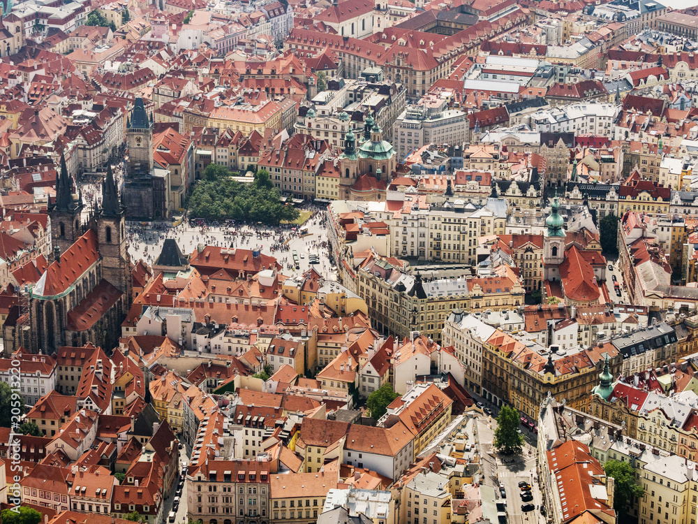 Aerial view on Prague City, Czech Republic. Tynsky temple. Panoramic view from airplane. Aerial view of Prague. The red roofs of Prague.