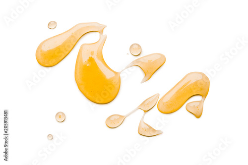 Liquid honey isolated on white background photo