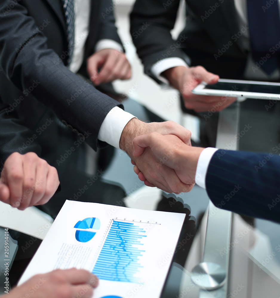 close up. investor and businessman shaking hands close up. investor and businessman shaking hands