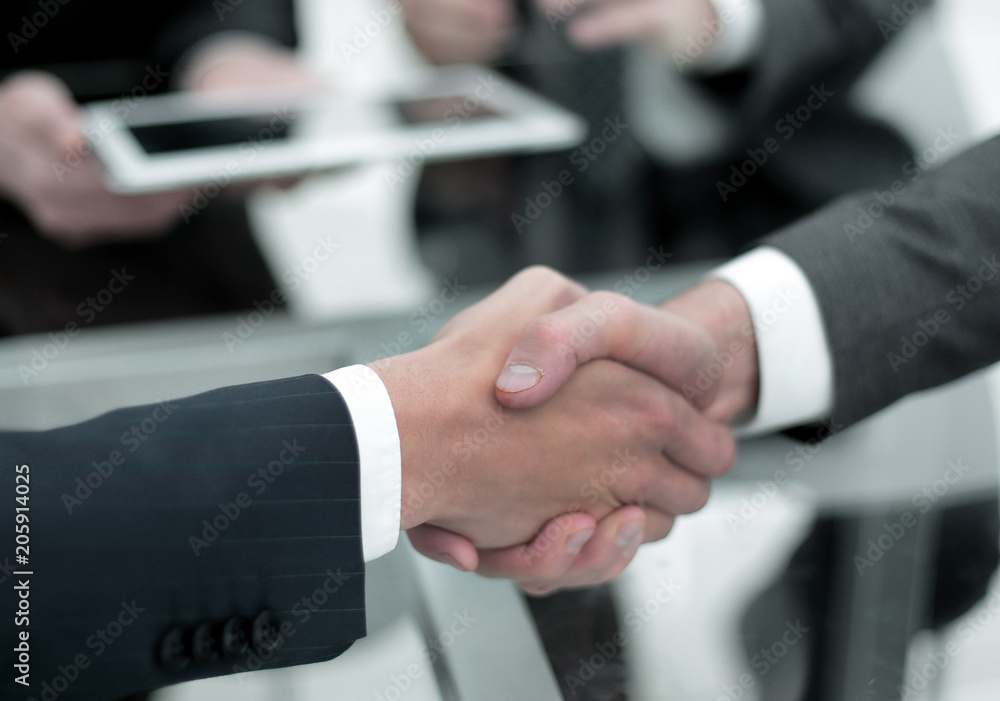 Close up of businessmen shaking hands Close up of businessmen shaking hands