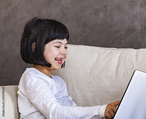Cute little girl with laptop