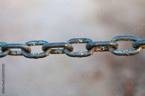 Close-up of a thick rusty chain outside