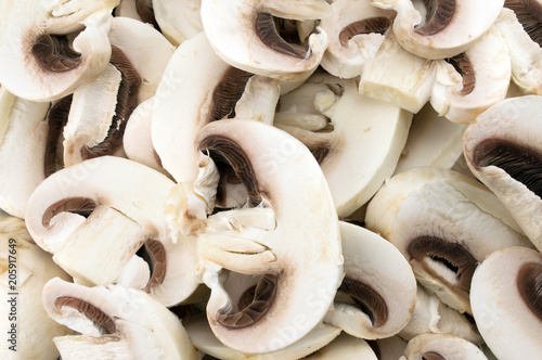 Sliced fresh champignon mushrooms background