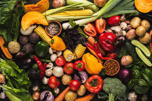 Heap of fresh vegetables on wooden background with copy space