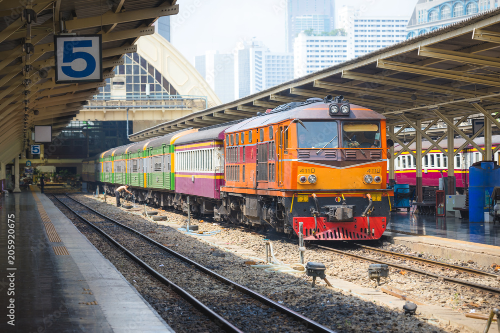 BANGKOK , THAILAND- MAY 04,2017: Trains waits at a platform of railway station Hua Lamphong in Bangkok during day BANGKOK , THAILAND- MAY 04,2017: Trains waits at a platform of railway station Hua Lamphong in Bangkok during day