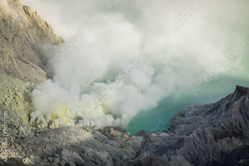 The sulfur smoke's eruptions. Kawah Ijen at Indonesia.