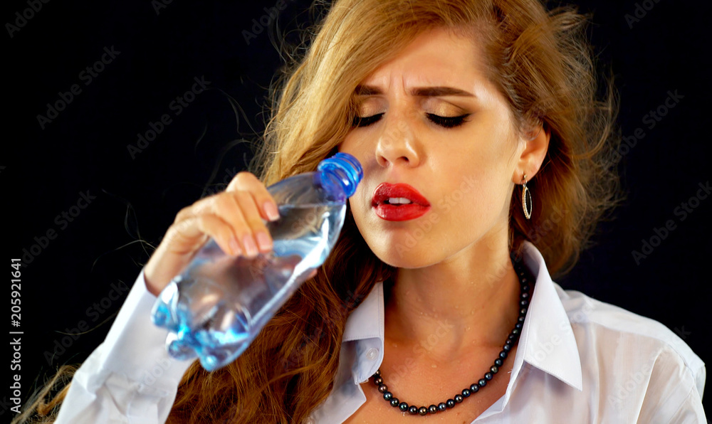 Sensitive teeth woman drinking cold water from bottle. Sudden toothache of  thirsty girl in business suit drink. In summer it is hot in office. Desire  to enjoy partner. Stock Photo | Adobe
