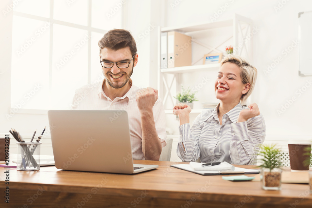Couple of business partners work at modern office Couple of business partners work at modern office
