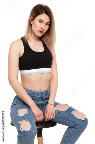 Sitting girl in a chair on a white background photo