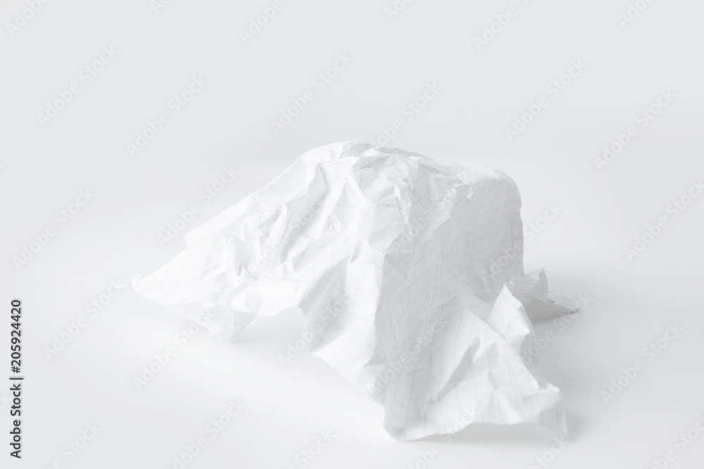 crumpled school notebook sheet on white background.photo with copy space