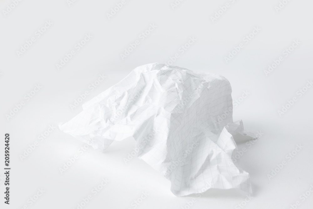 crumpled school notebook sheet on white background.photo with copy space crumpled school notebook sheet on white background.photo with copy space