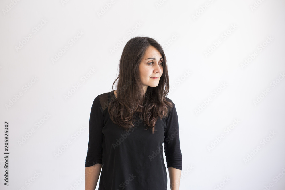 portrait of a young beautiful woman over white background. Indoors and lifestyle. Casual clothing