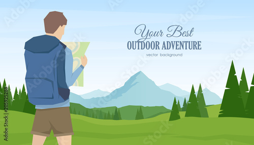 Young man traveler and hiker with map in the hands on summer mountains landscape background